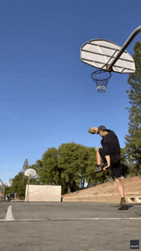 Man Lands Impressive Trick Shot While Balancing on Slackline