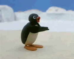 Stop motion gif. Claymation penguin Pingu stands in a snowy landscape and claps his flipper-like wings in applause. 