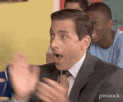 The Office gif. Steve Carell as Michael Scott claps his hands vigorously as the camera zooms in on his face. He's obviously excited, mouthing "wow," over and over. 