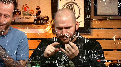 A man trying to work out complex equations by counting with his fingers