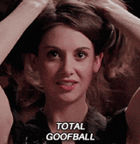 Movie gif. Alison Brie as Lainey in Sleeping With Other People holds her hair up in messy pig tails and makes a funny face with bug eyes, flared nostrils, and teeth bared. Text, "Total goofball."