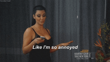 Reality TV gif. Kim Kardashian on Kourtney & Kim Take New York looks down at her phone and then looks up, saying, "Like I'm so annoyed," which appears as text.