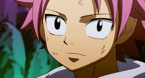 Natsu Dragneel from Fairy Tail happily giving a smile.