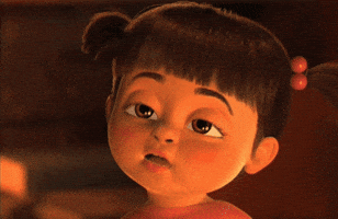 Movie gif. A closeup of a sleepy Boo from Monsters Inc blinking at us.