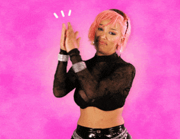 Celebrity gif. Doja Cat claps with raised arms with a slight pout as if impressed, each of her claps punctuated by three animated white lines, all against an airbrushed pink background.
