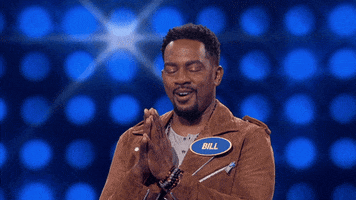 TV gif. Contestant Bill on Family Feud presses his palms together and bows his head in prayer. 