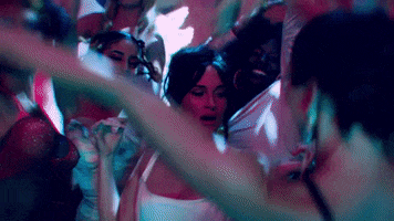 Music video gif. Kacey Musgraves in her music video for Star-Crossed. She's in a club dancing with all her girls, jumping up and down and having fun.