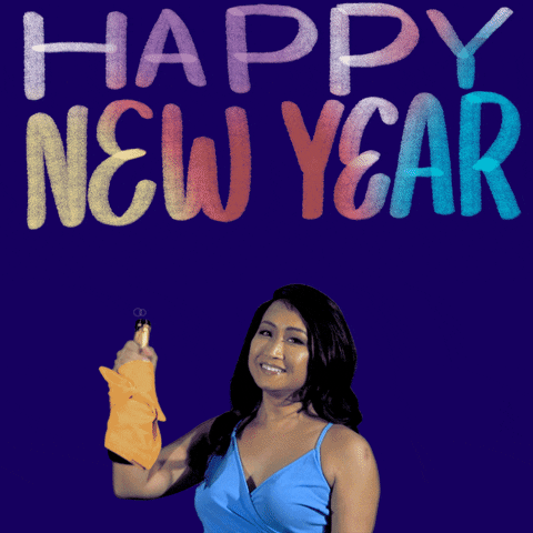 Video gif. Woman holds up a bottle of champagne and shakes her body excitedly as she smiles at us. Bubbles fall off the side of the bottle. Text, “Happy new year!”