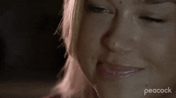TV gif. Adrianne Palicki as Tyra Collette in Friday Night Lights smirks at someone, and nods her head as if impressed. She holds a red solo cup up and clinks cups with someone as she says, “Amen.”