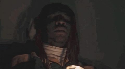 Animated GIF of rapper Lil Keed dancing energetically and freely.