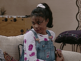 TV gif. Tatyana Ali as Ashley in The Fresh Prince of Bel-Air purses her lips, then turns away as she shakes her head and rolls her eyes.