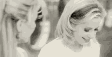 Movie gif. Black-and-white capture of Mira Sorvino as Romy in Romy and Michele's High School Reunion looking at Michelle with wide eyed and smiling saying "Me too!"