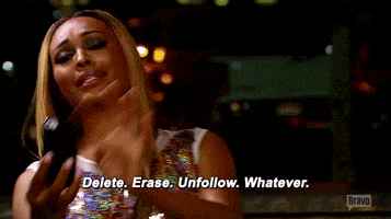 Reality TV gif. Cynthia Bailey from Real Housewives of Atlanta is scrolling through her phone and says, "Delete. Erase. Unfollow. Whatever." while Nene Leakes watches her.