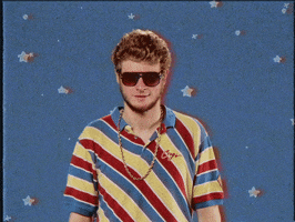 Celebrity gif. Yung Gravy, a rapper, shrugs his shoulders and tosses his head back nonchalantly as stars twinkle behind him.