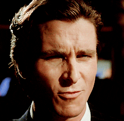 Movie gif. Christian Bale as Patrick Bateman in American Psycho smiles and nods approvingly and furrows his brow, as if he's scorched by someone attractive.