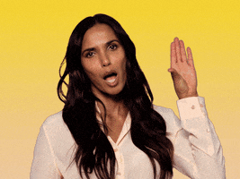 Celebrity gif. Padma Lakshmi looks bored as she stares at us and uses her hand to make a sarcastic talking motion while saying, "Blah blah blah."