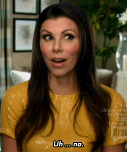 Reality TV gif. Heather Dubrow from Real Housewives of Orange County smiles and blinks with sass. Text, "Uh...No."