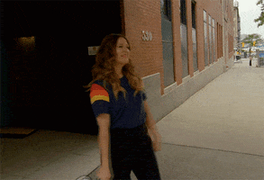 Celebrity gif. Drew Barrymore holds a megaphone up to her mouth and shouts into it, "Mondays!"
