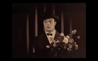 runmrun flowers buster keaton keaton waiting with flowers GIF