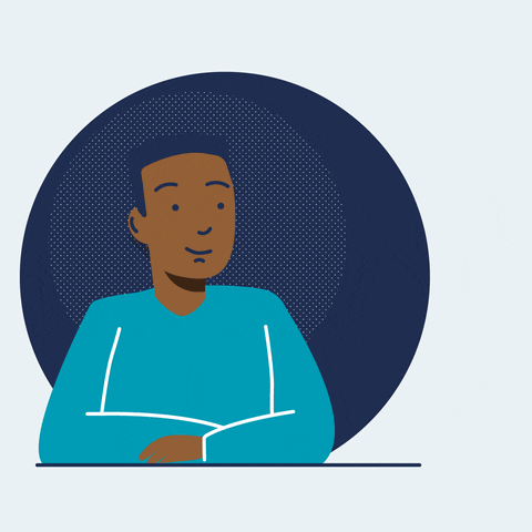 Desk with leather desk pad, walnut desk organizer, wireless keyboard and mouse, and porcelain mug.