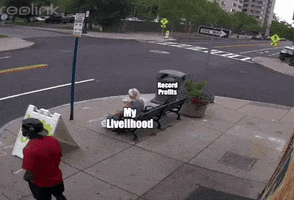 Meme gif. Garbage truck pulls up to a corner, on which is a large trash can positioned next to a bench on which an older woman is sitting. The truck's removal machine reaches out to grab the trash can but accidentally catches on to the bench, throwing the bench around and tossing the woman onto the ground. The truck is labeled "Billionaires," the garbage can is labeled "Record profits," and the woman is labeled "My livelihood."