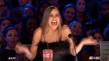 Celebrity gif. Sofia Vergara as a judge on America's Got Talent is ecstatic about a contestant and says, "Yes!" while shaking her outstretched hands and head up and down.