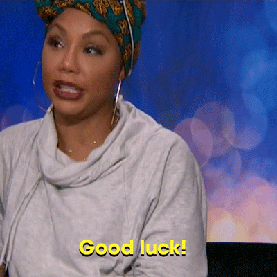 Celebrity Big Brother gif. Tamar Braxton sits back against a chair and raises her hands to fix her headwrap as she emphatically says "Good luck" with raised eyebrows.