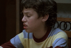 TV gif. John Francis Daley as Sam in Freaks and Geeks turns his head with a grimace, his eyes looking extremely annoyed or skeptical.