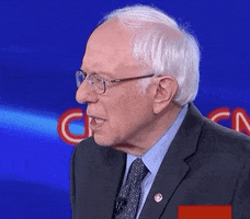 Political gif. In front of a blue CNN backdrop, Bernie Sanders is taken aback and looks around in disbelief.
