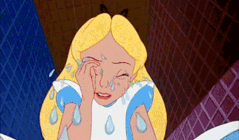 Movie gif. Alice from Disney's Alice in Wonderland sits, leaned over, as she sobs uncontrollably. Her tears are so large that they splash all over the place.