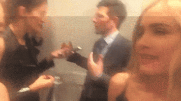strippingdowncelebs shoulder shrug whatevs maude apatow GIF