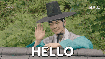 TV gif. Cha Eun-woo as Yi Rim in Rookie Historian Goo Hae-ryung leans on the edge of a fence, smiling and waving hello.