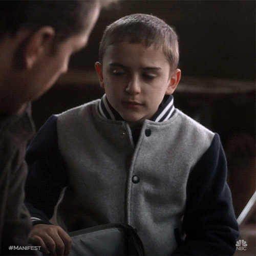 TV gif. Jack Messina as Cal Stone on Manifest shrugs his shoulders.