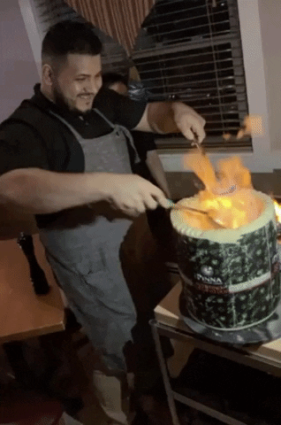 risottorestaurant fire cheese pasta risotto GIF