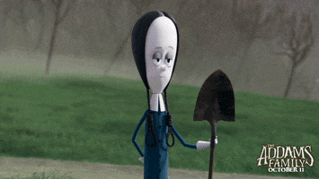 Cartoon gif. Wednesday from the Addams Family animated movie holds a shovel in one hand and reveals an air horn in the other. She smirks deviously.