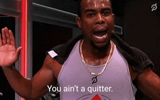 Celebrity gif. Alex Toussaint of Peloton, towel over his sweaty shoulders, hands gesturing for emphasis, looks at us intently, saying, "You ain't a quitter."