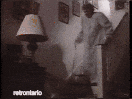 Ad gif. Three consecutive clips of elderly people dramatically falling down. An old woman falls down the stairs. An old man clutches his chest and falls over. An old woman watering plants drops her watering can and begins to fall.