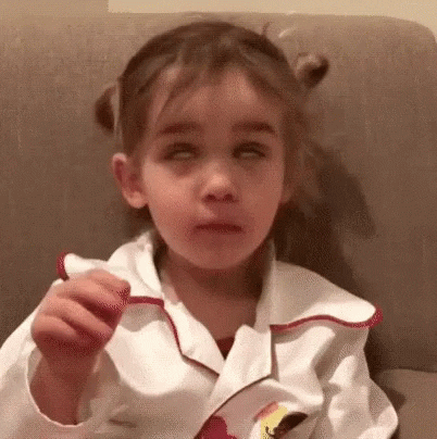Video gif. A little girl with her hair in pigtails rolls her eyes and flops her hand over as if to say, 