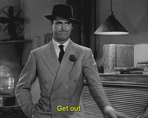 Black and white gif of a man in a suit and hat pointing and saying 'get out'