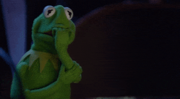 TV gif. Kermit the Frog from The Muppets chews on his frog fingers as if he has fingernails and trembles in fear. 