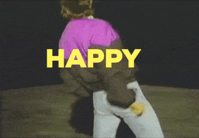 Video gif. A man in a purple and black windbreaker faces away from us, gyrating with his hips forward in three separate pelvic thrust motions. Text, "Happy hump day!"
