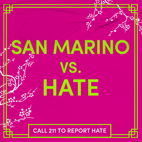 Text gif. Chartreuse letters on a hot pink background, surrounded by swaying cherry blossom branches as a butterfly glides through. Text, "San Marino vs hate, call 211 to report hate."