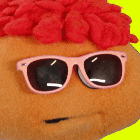Video gif. We're zoomed in on Gerbert the Puppet's sunglassed face and he rolls his head while saying, "Awesome!"