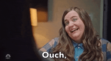 SNL gif. Comedian Aidy Bryant sarcastically smiles while saying "Ouch...but true."