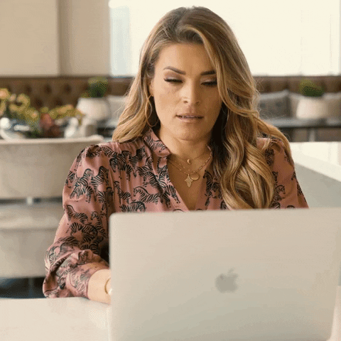 Video gif. Entrepreneur Jasmine Starr in front of a laptop, leaning back in her chair, looking exasperated.
