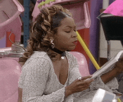 TV gif. Tichina Arnold as Pam in Martin. She's reading and turns her head slowly, perturbed at the disturbance. Her eyebrows are furrowed and she looks very annoyed, as she gives us the death stare. 