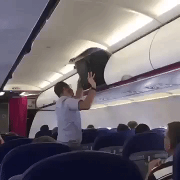 Mantriestoputbaginoverheadlocker GIF