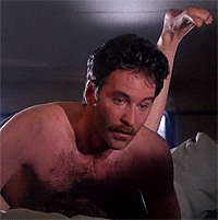 Movie gif. Kevin Kline as Otto in A Fish Called Wanda. He's having sex with a woman and looks up in a state of rapture. Her feet dangle in the air behind him and he goes cross-eyed as he continues to make absolutely ridiculous faces of pleasure.