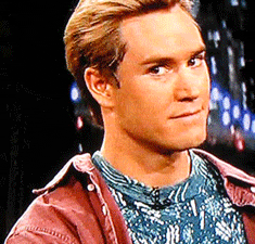 TV gif. Mark-Paul Gosselaar as Zack Morris from Saved by the Bell looks at us, winks, then looks away.