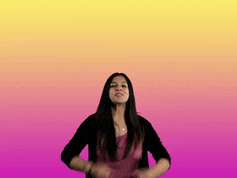 Video gif. Reeda Saleem jumps forward with arms outstretched as she smiles enthusiastically and says, "Welcome!"